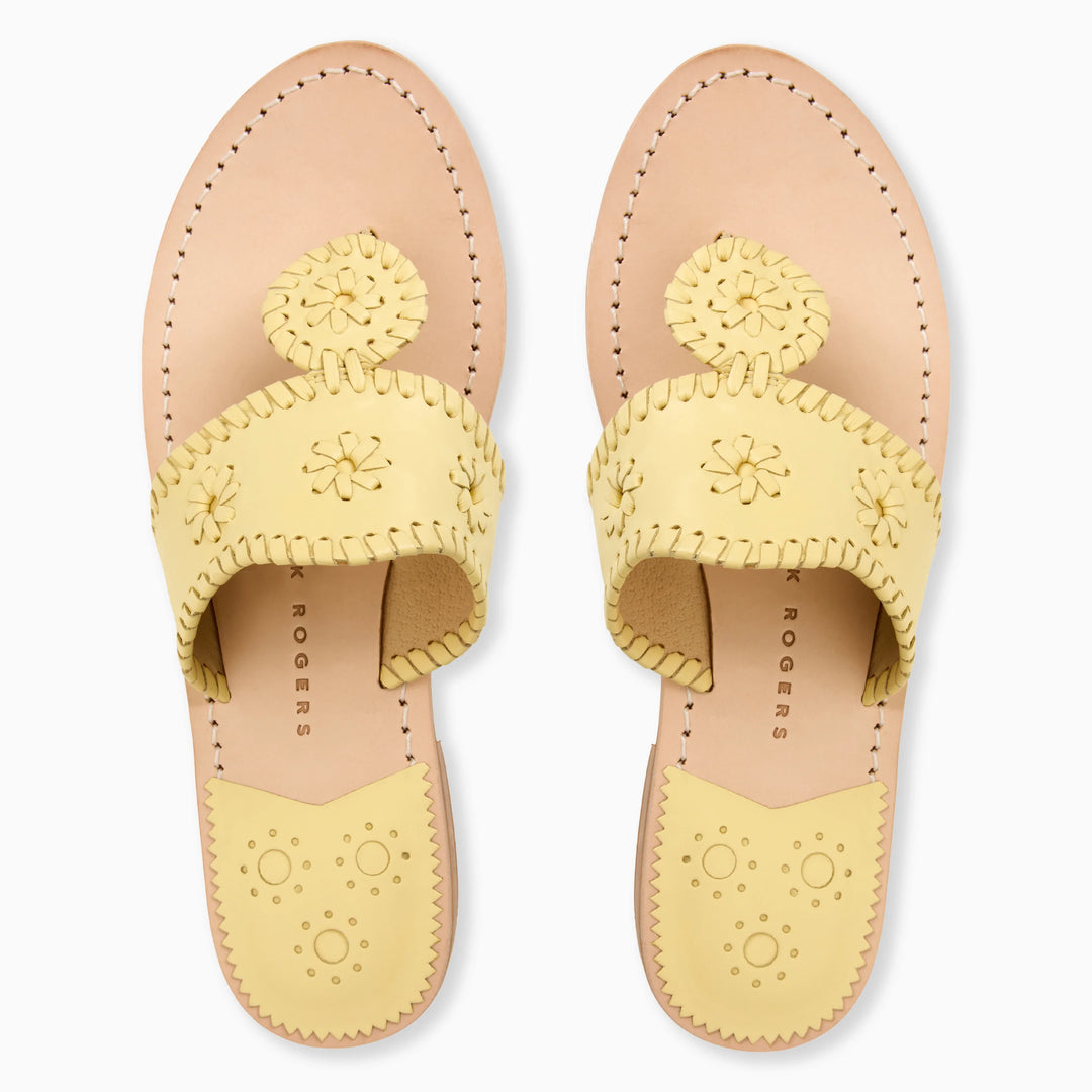 The Zertz JACKS FLAT SANDAL NAPPA in pastel yellow features decorative stitching, cut-out flower designs, and scalloped edges in flexible leather, shown from above on a white background.