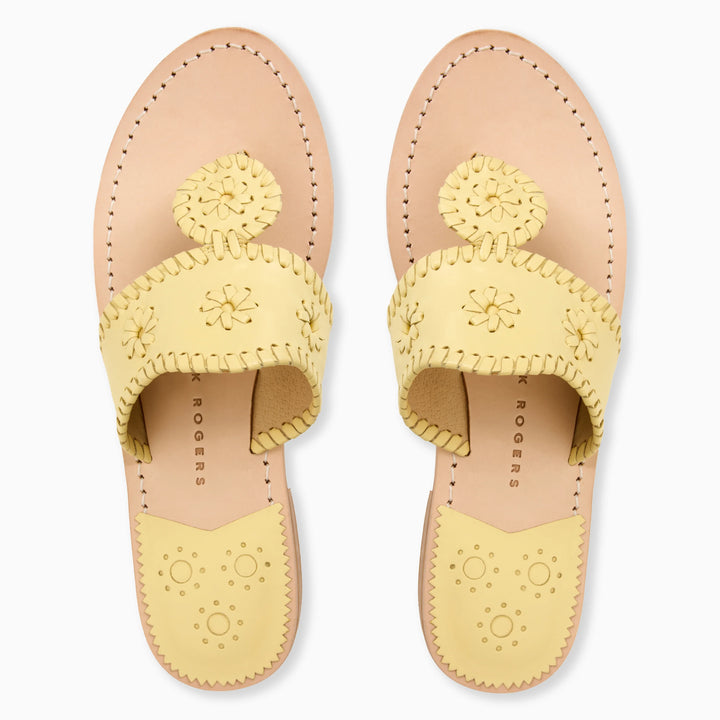 The Zertz JACKS FLAT SANDAL NAPPA in pastel yellow features decorative stitching, cut-out flower designs, and scalloped edges in flexible leather, shown from above on a white background.