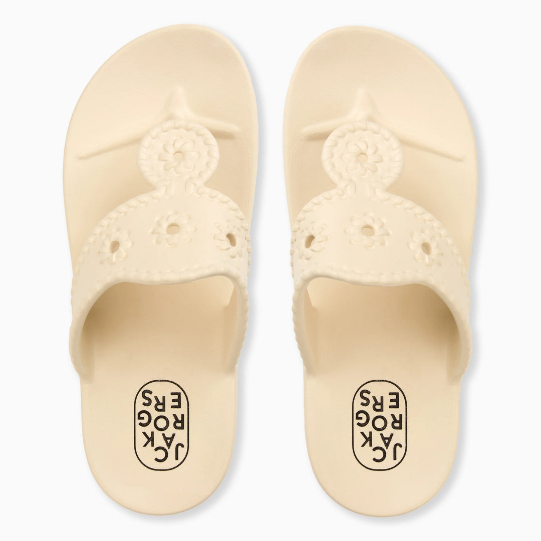 A pair of CREAM JACKS EVA sandals by Zertz, featuring ergonomic design, floral cutout straps, and the brand name on the footbed.