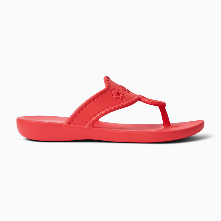 The Zertz JACKS EVA is a vivid red ergonomic sandal with a textured strap and gently elevated sole, displayed in profile on a white background.