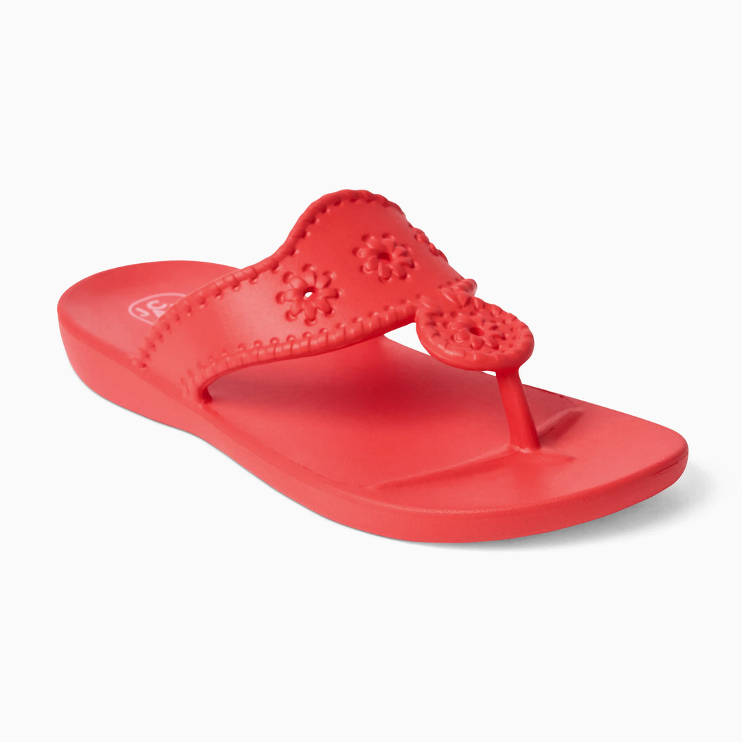 The Zertz JACKS EVA sandal features a bright red color, decorative flower patterns on the strap, and a pineapple design near the toe, displayed against a white background.