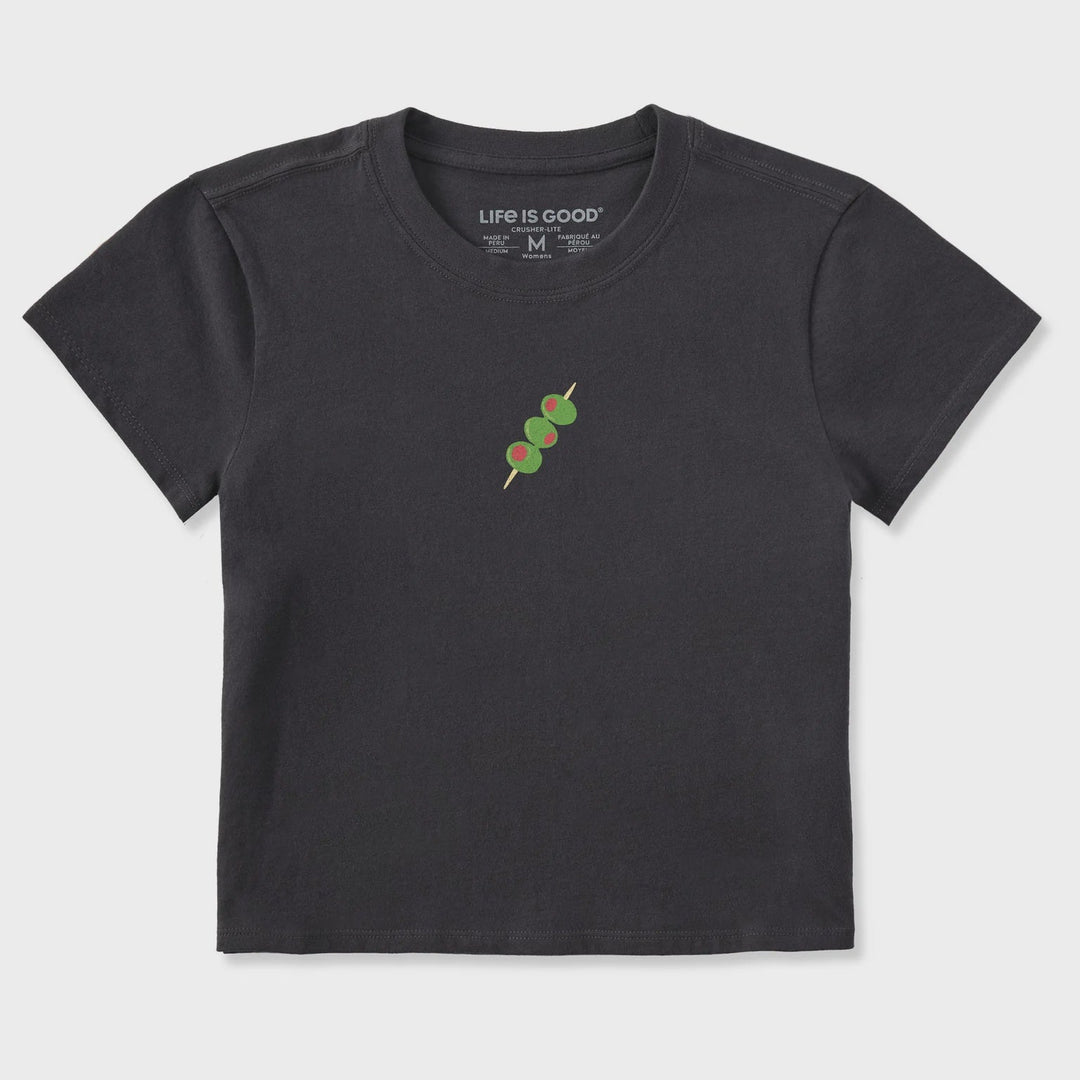 The Zertz W CRUSHER-LITE OLIVE STACK MINI is a black short-sleeve tee featuring a ribbed neckline and a small graphic of three green olives on a toothpick centered on the chest.