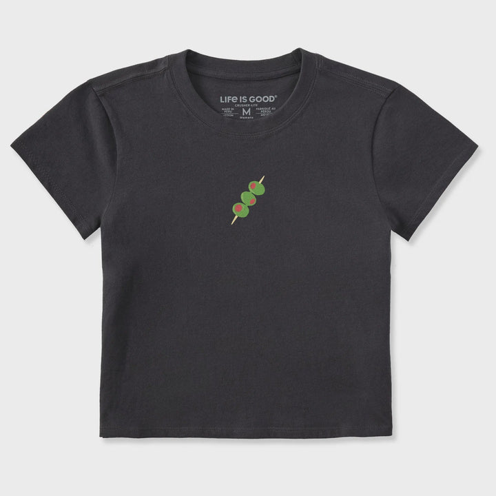 The Zertz W CRUSHER-LITE OLIVE STACK MINI is a black short-sleeve tee featuring a ribbed neckline and a small graphic of three green olives on a toothpick centered on the chest.