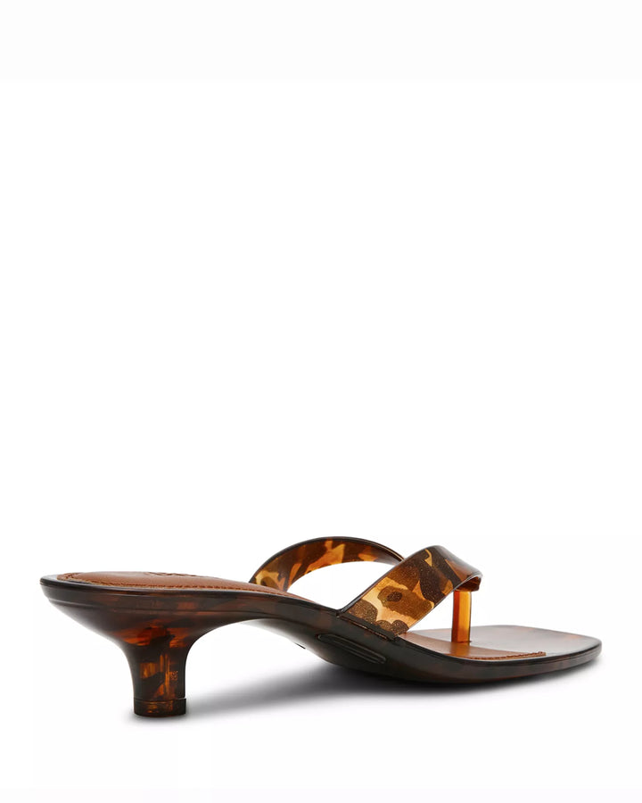 The Zertz TRACIE SANDAL is a brown tortoiseshell-patterned heeled sandal featuring a low flared heel and single thong strap, combining comfort and versatile style. Shown on a white background.