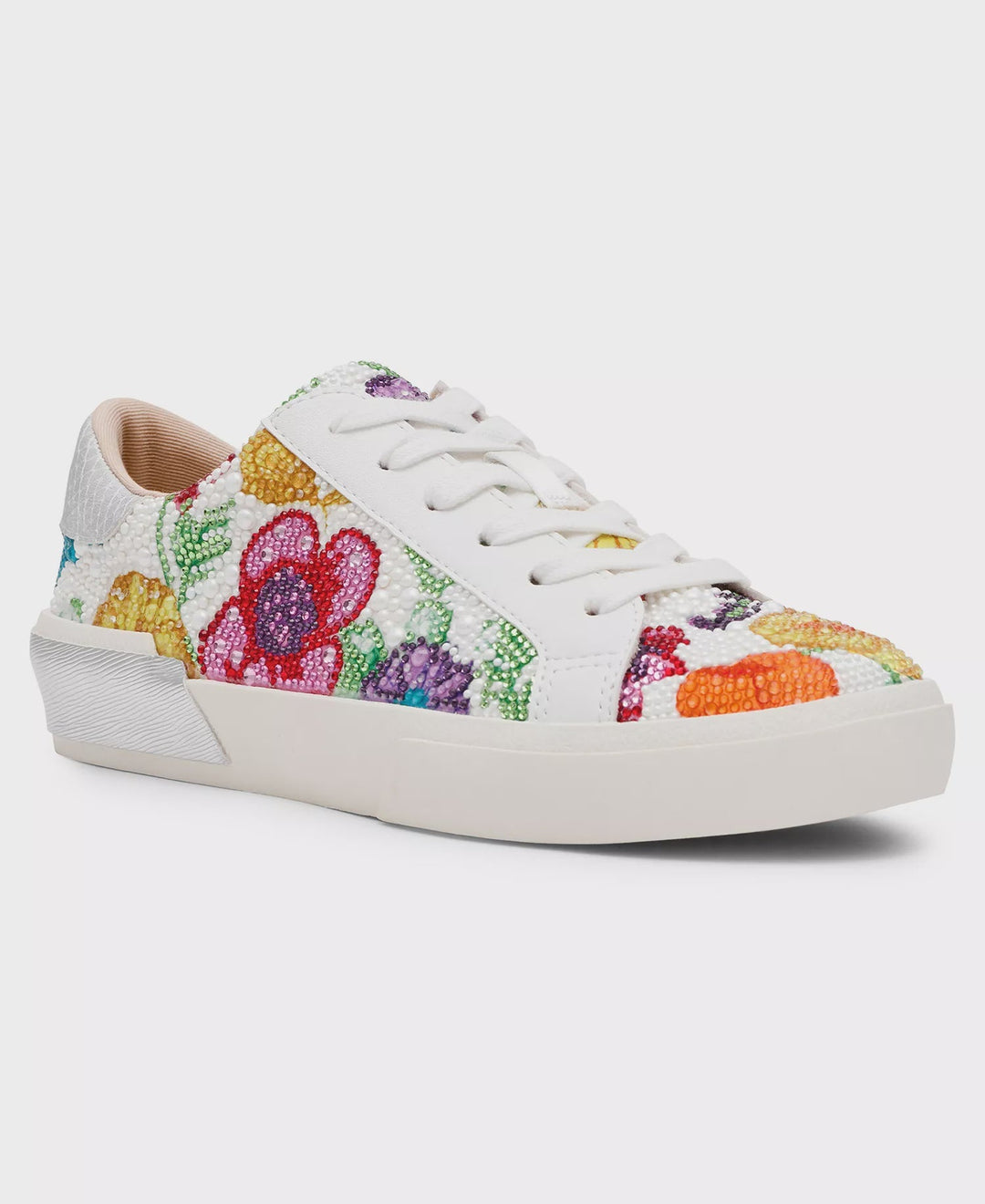 The Zertz DAMON SNEAKER SB-DAMNON is a white lace-up sneaker adorned with vibrant floral embroidery, beaded accents, crisp white laces, and a matching sole.