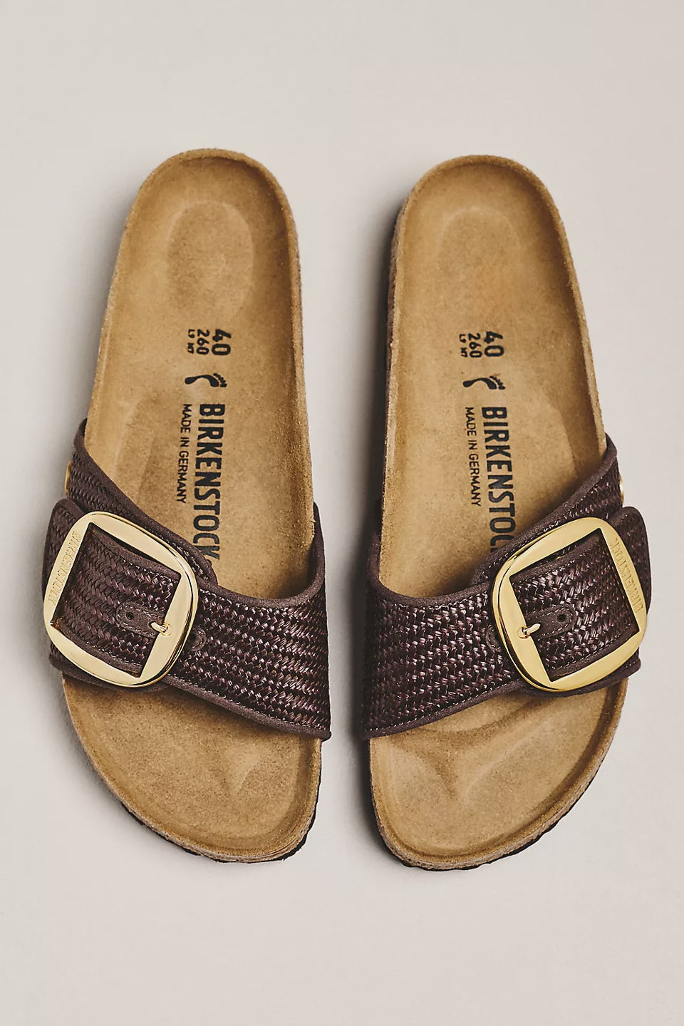 A pair of Zertz MADRID BIG BUCKLE TEX RAFFIA N sandals with textured brown straps, oversized gold buckles, and a contoured footbed, displayed side by side on a light background.