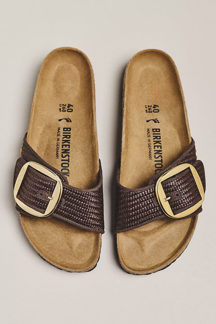 A pair of Zertz MADRID BIG BUCKLE TEX RAFFIA N sandals with textured brown straps, oversized gold buckles, and a contoured footbed, displayed side by side on a light background.