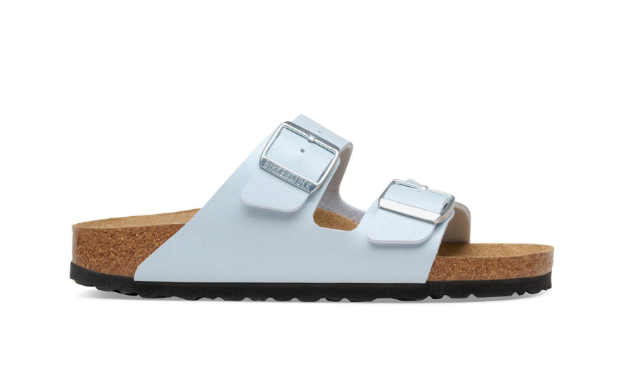 The Zertz ARIZONA BF GRACEFUL BABY BLUE N 1031608 sandal features light blue straps with two large silver buckles, a cork footbed, and a black textured sole, displayed in side profile on a white background.