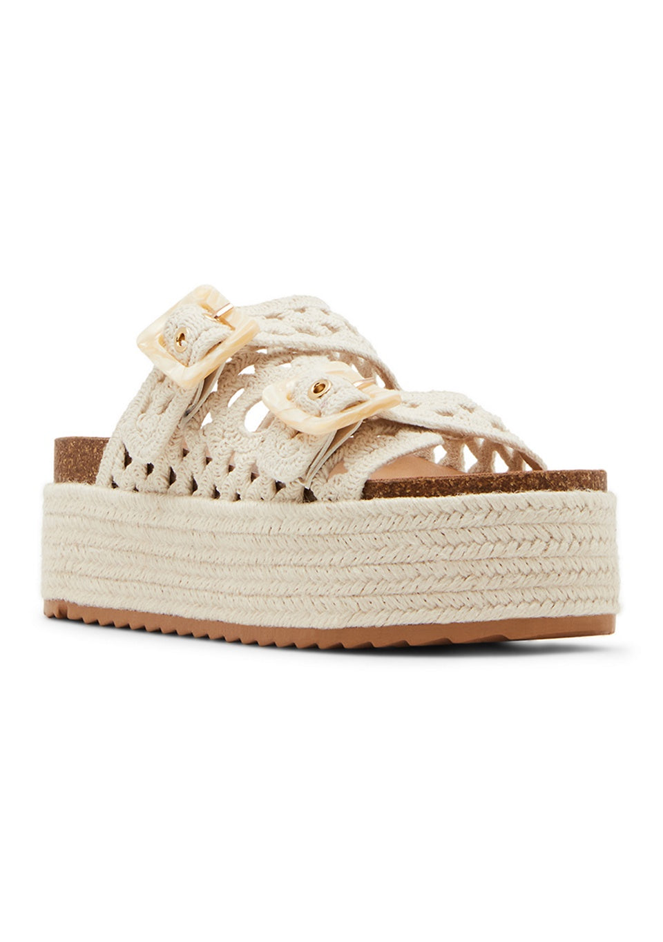 The BALI PLATFORM SANDAL by Zertz is a beige crochet-strap sandal with two large matching buckles and a textured, thick espadrille platform sole.