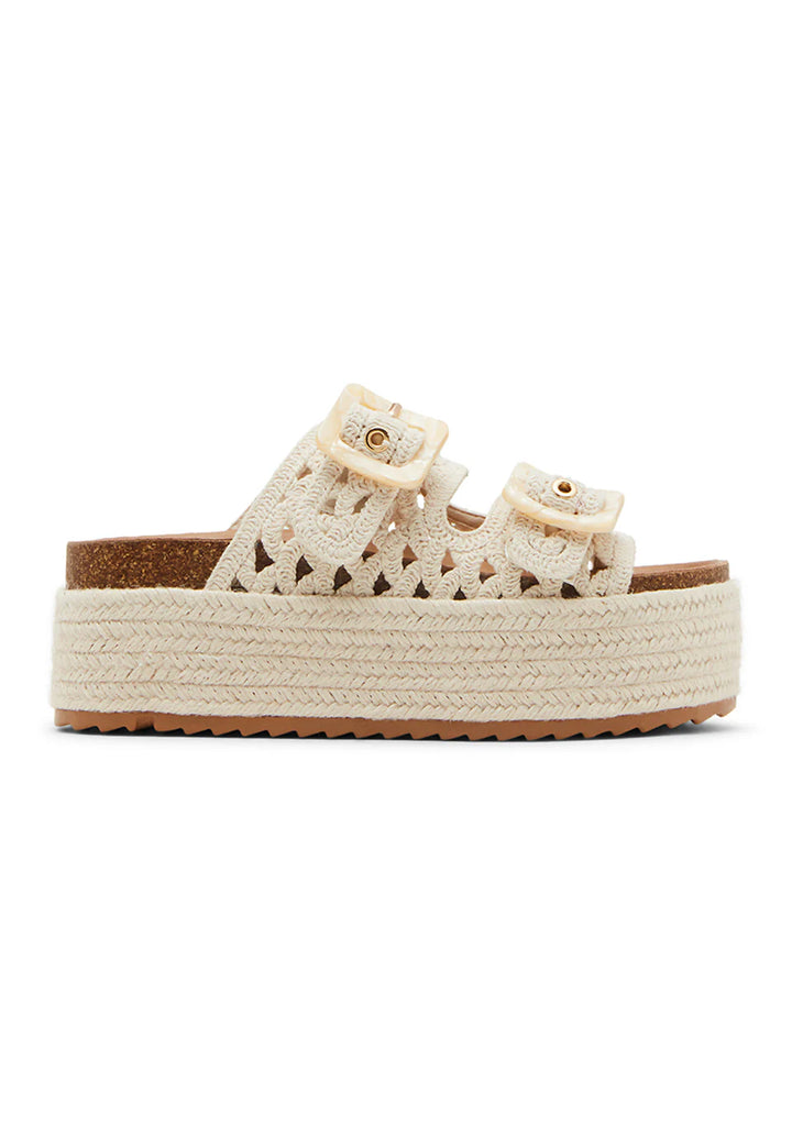 The Zertz BALI PLATFORM SANDAL features a cream color, woven detailing, two adjustable buckle straps, and a thick textured espadrille platform sole for a casual, summery look.