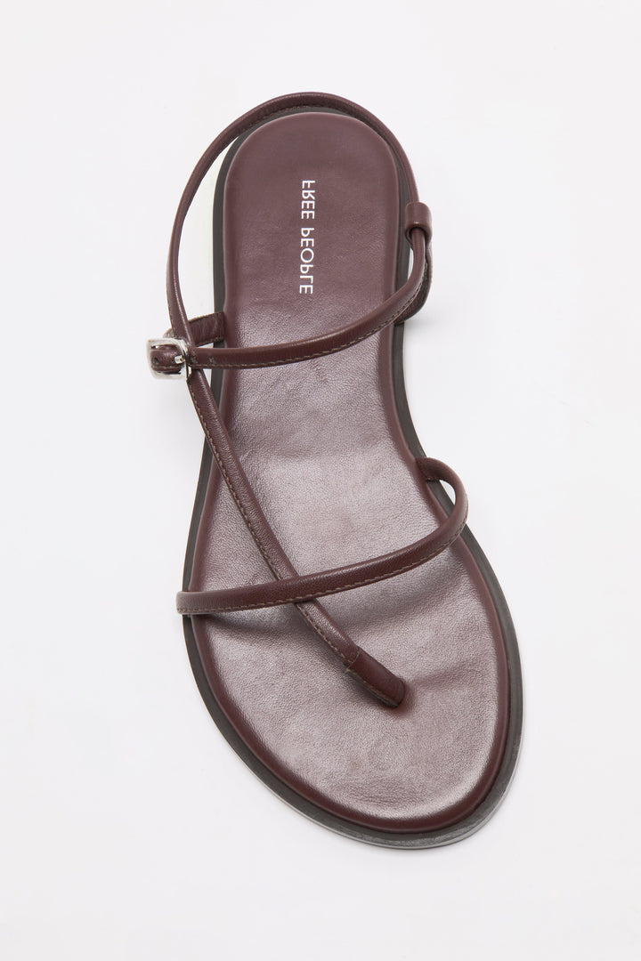 A single flat brown CORSICA STRAPPY SANDAL by Zertz, featuring thin crisscross straps and an ankle strap, displayed on a white background—an ideal pick for stylish comfort.