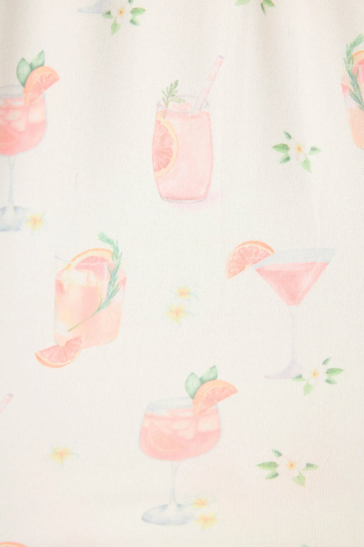The Zertz PALOMA MAMA PJ PANT features butter jersey fabric with pink cocktail illustrations—like playful Palomas with citrus and straws—plus small white flowers, all set on a light background.