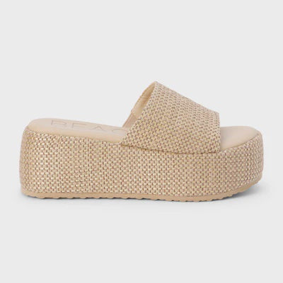 The Zertz PISMO PLATFORM SANDAL is a beige vegan sandal featuring a thick woven jute flatform sole and a wide woven strap, shown against a light gray background.