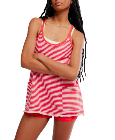 A woman with long braids crosses her arms, wearing a Zertz HOT SHOT MINI PRINTED red and white striped sleeveless top with pockets and matching red shorts, standing against a plain background.