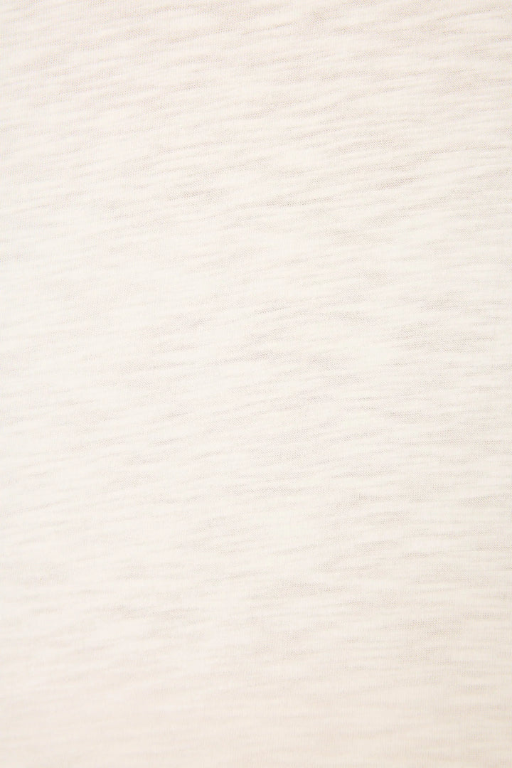 A close-up of the light beige cotton-modal slub jersey on the Zertz PUPCATION PALMS DOG MOM TEE, showing its soft feel and subtle horizontal texture—perfect for a relaxed, comfortable fit.