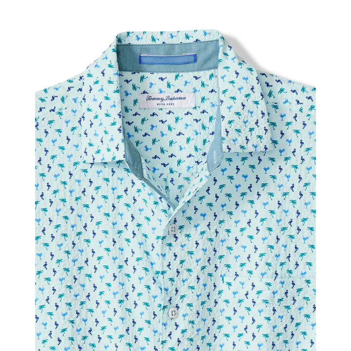 The Zertz NOVA WAVE FLOCK IT TO YOU is a light blue cotton collared shirt featuring small blue and green palm tree prints and an inner Zertz label.