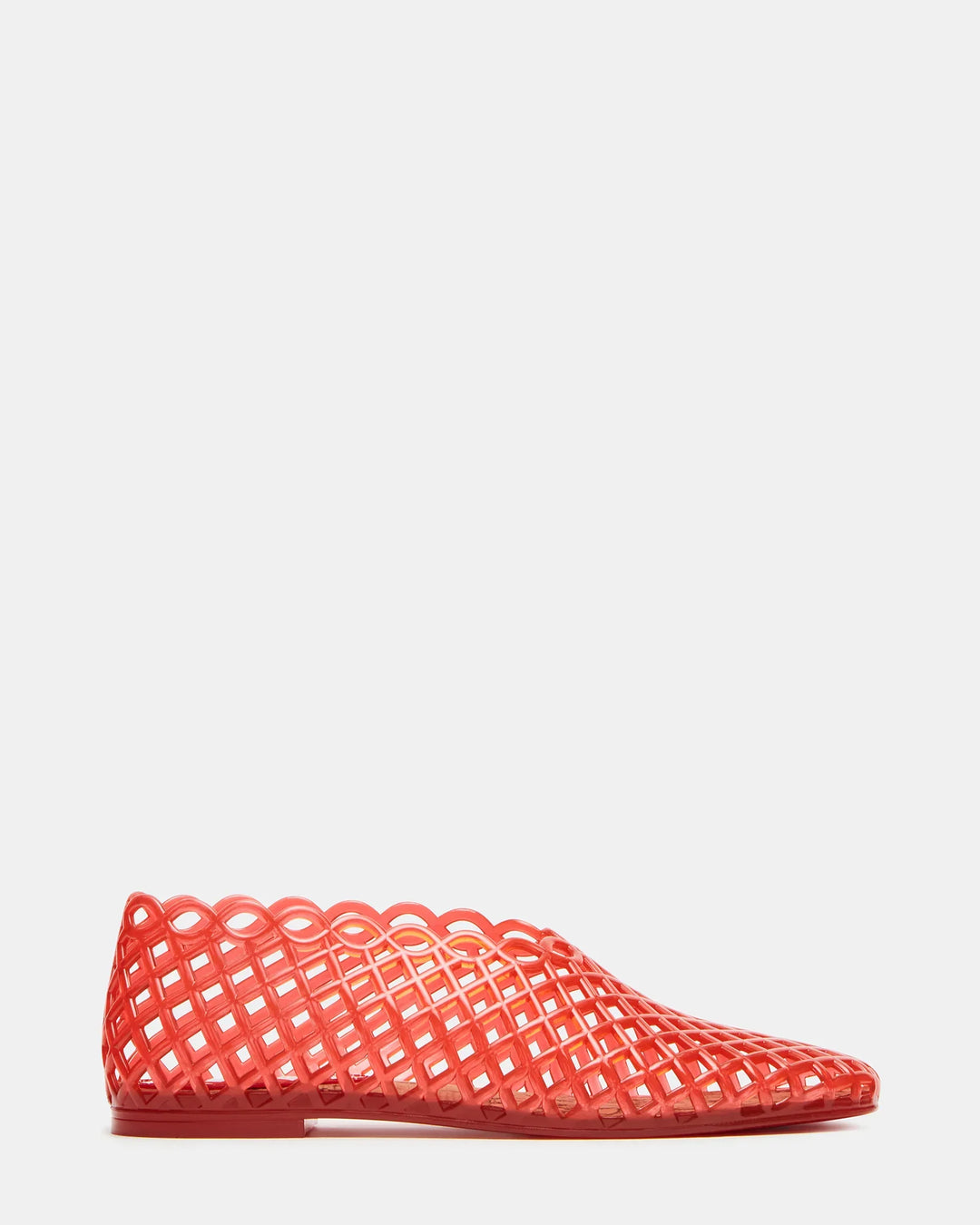The Zertz GROVE JELLY SLIP ON is a red, transparent plastic flat shoe with a jelly cage design, lattice basket-weave pattern, and scalloped edges, shown in profile on a plain white background.
