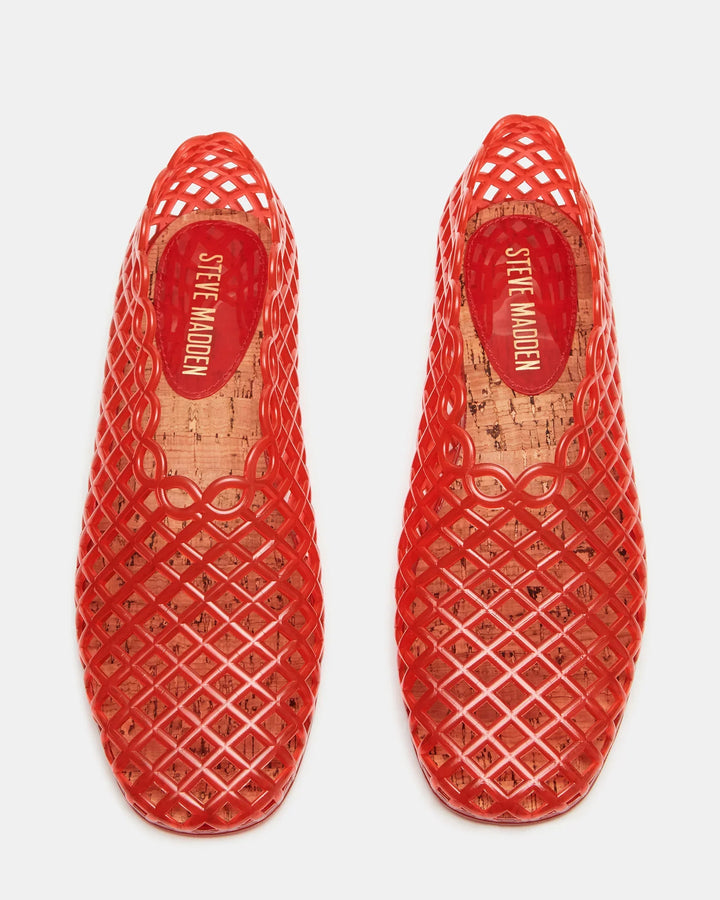 A pair of red GROVE JELLY SLIP ON shoes by Zertz with a lattice jelly cage design and cork insoles featuring the brand logo, shown from above on a white background.