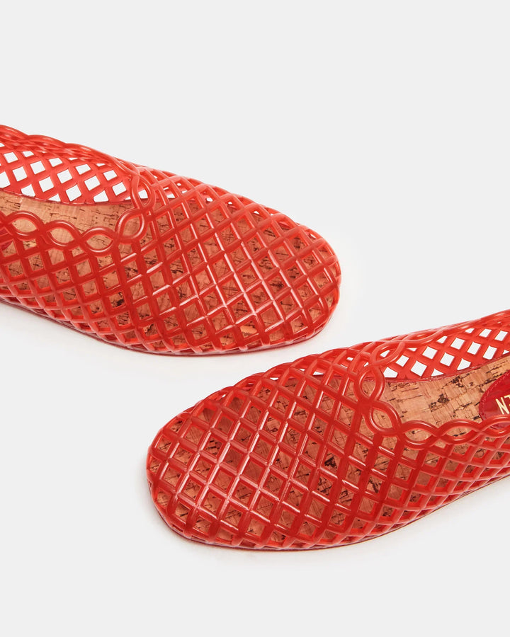 Close-up of two red GROVE JELLY SLIP ON ballet flats by Zertz, featuring a lattice-patterned mesh and rounded toes—stylish and comfortable for daily wear—displayed against a plain white background.