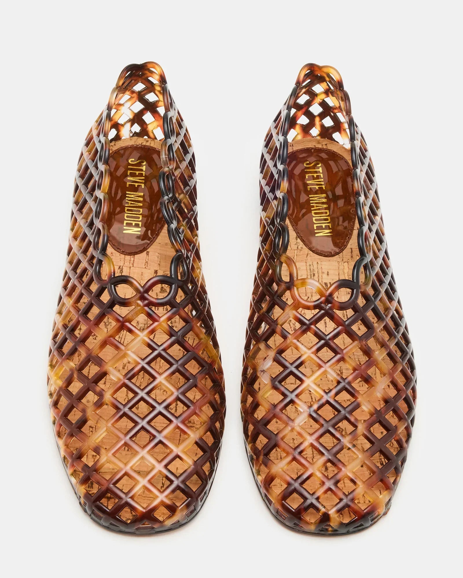 A pair of brown GROVE JELLY SLIP ON shoes by Zertz are shown from above, featuring a lattice-patterned woven jelly cage design—an ideal square-toe flat for comfortable everyday wear.