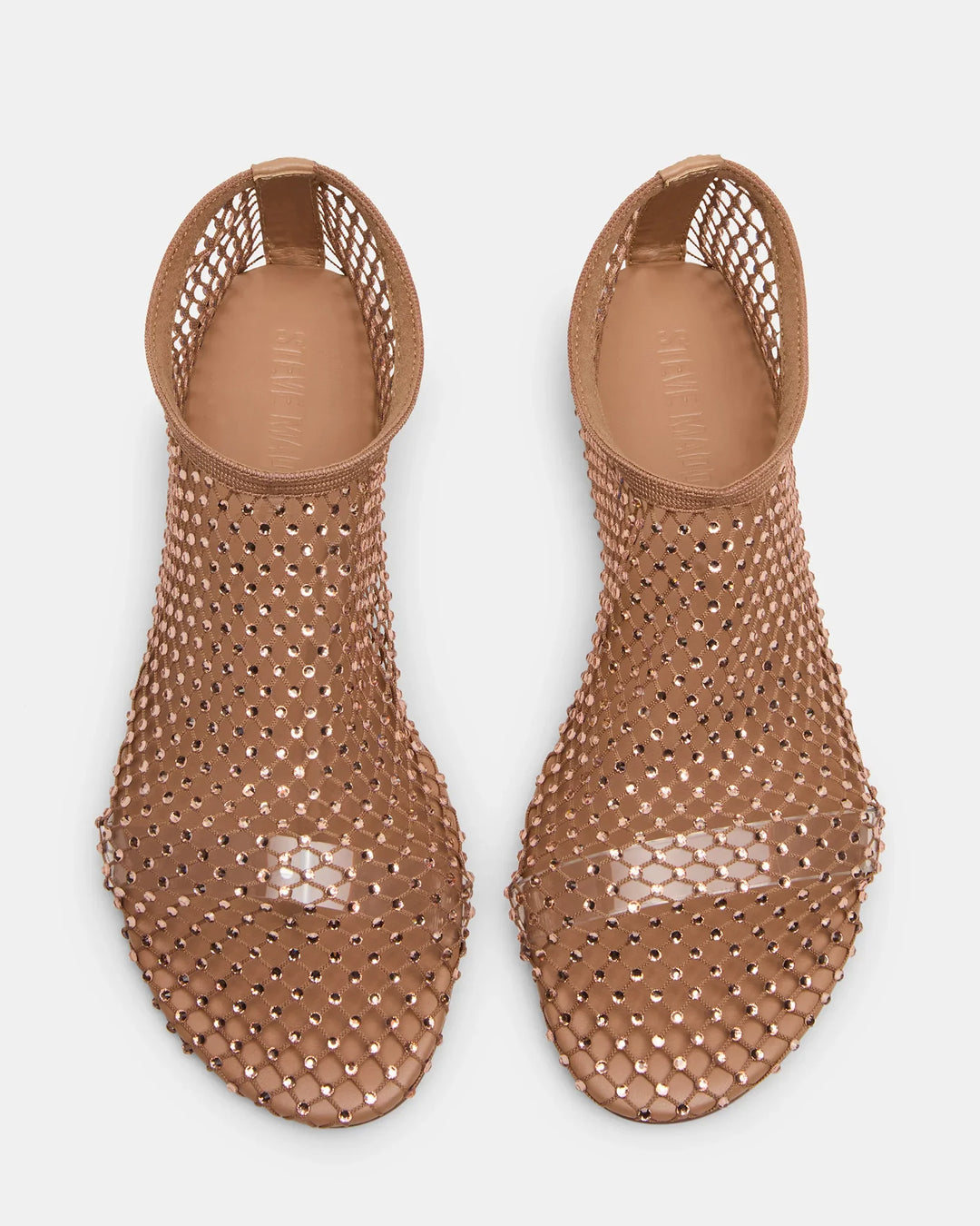 The MINO RHINESTONE FLAT by Zertz is a pair of nude, open-toe, slip-on mesh flats featuring a netted design with rhinestones and cut-out heels, shown from above on a white background.