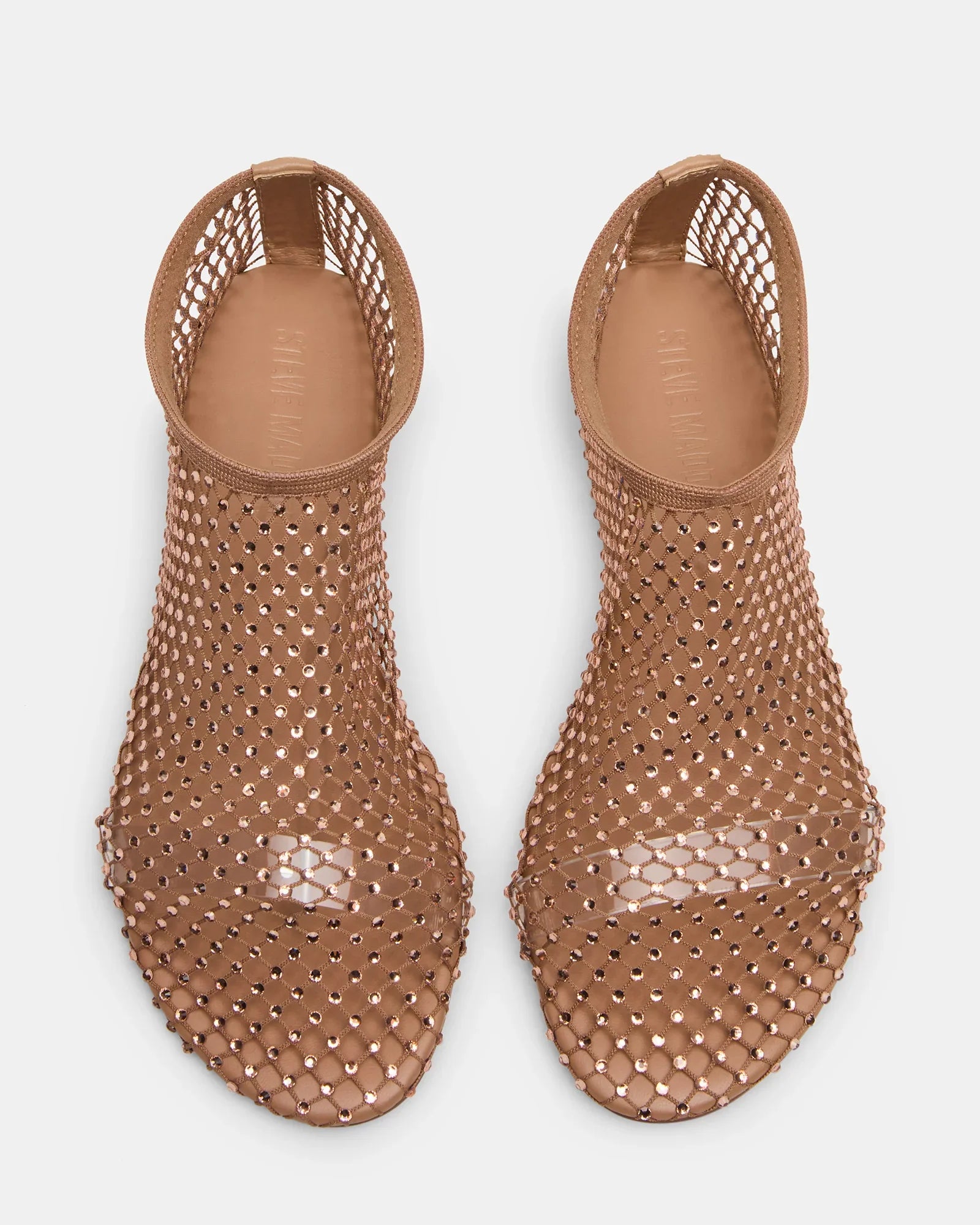 The MINO RHINESTONE FLAT by Zertz is a pair of nude, open-toe, slip-on mesh flats featuring a netted design with rhinestones and cut-out heels, shown from above on a white background.
