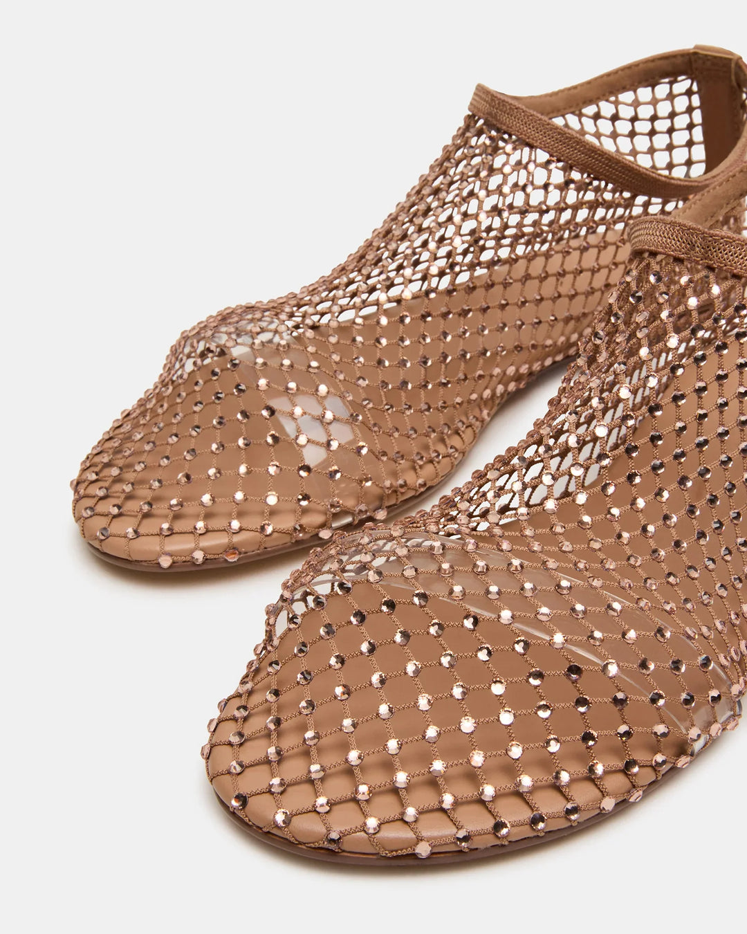 Close-up of Zertz MINO RHINESTONE FLATs in light brown, showcasing a mesh upper with fishnet detail and solid soles, perfect for adding elegant style to any outfit. Photographed against a white background.