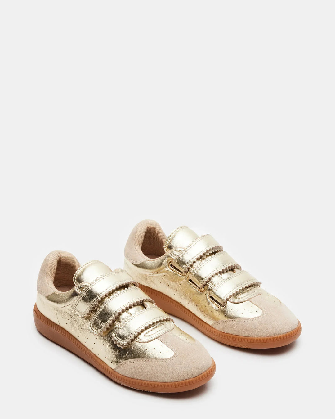 The Zertz MOMENTUM SNEAKERS feature gold metallic leather and suede with beige accents, three Velcro straps, a classic low-top design, and brown rubber soles, shown against a plain white background.