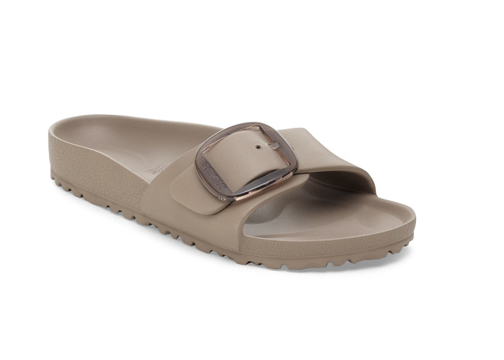 The Zertz MADRID BIG BUCKLE EVA GRAY TAUPE N is a single gray taupe sandal with a textured sole, wide strap, large shiny buckle, open toe, and slightly raised heel.