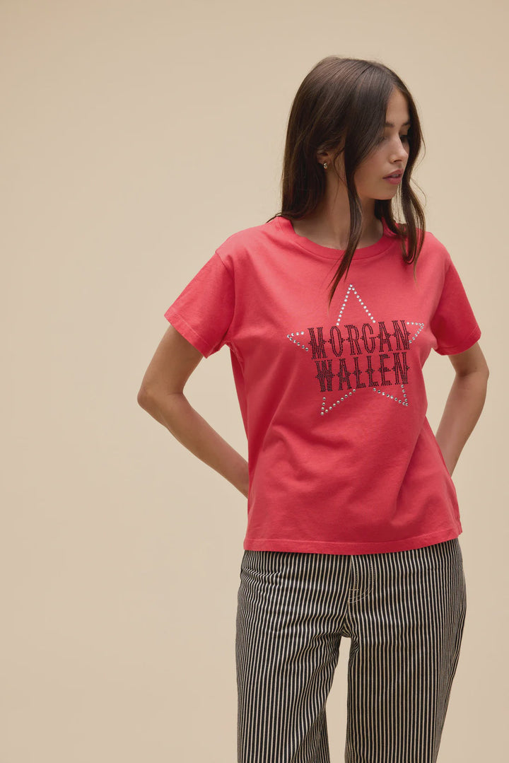 A woman stands against a beige background wearing Zertz&