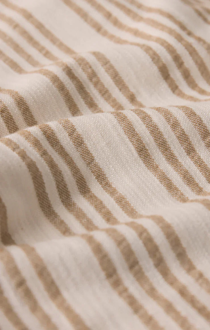 Close-up of the SLOANE KNIT STRIPED TOP by Zertz, featuring a soft cotton blend knit with light beige and white parallel stripes, lightweight texture, subtle wrinkles, and a cozy woven look.