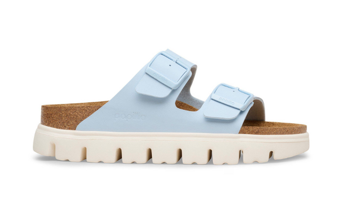 The Zertz ARIZONA CHUNKY BF BABY BLUE N 1031206 sandal features two adjustable buckle straps, a contoured cork footbed, and a thick white rugged sole. Shown in profile, this light blue platform sandal stands out on a white background.
