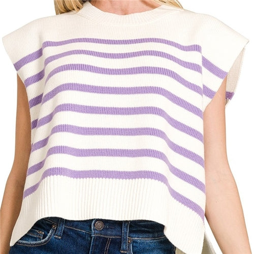 A person wears the Sariah Top by Loca on Main—a sleeveless, cream knit with horizontal lavender stripes—paired with blue jeans.