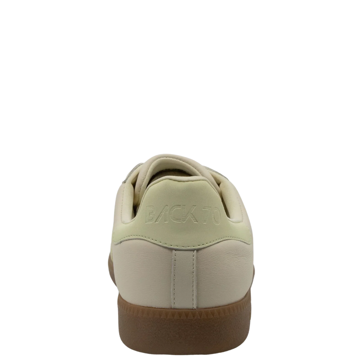 The Zertz CLOUD D26 BUTTER YELLOW SNEAKER for women features a beige pastel look, light green heel accent, "BACK TO" embossed on the heel tab, and a brown rubber sole—ideal for minimalist luxe streetwear.