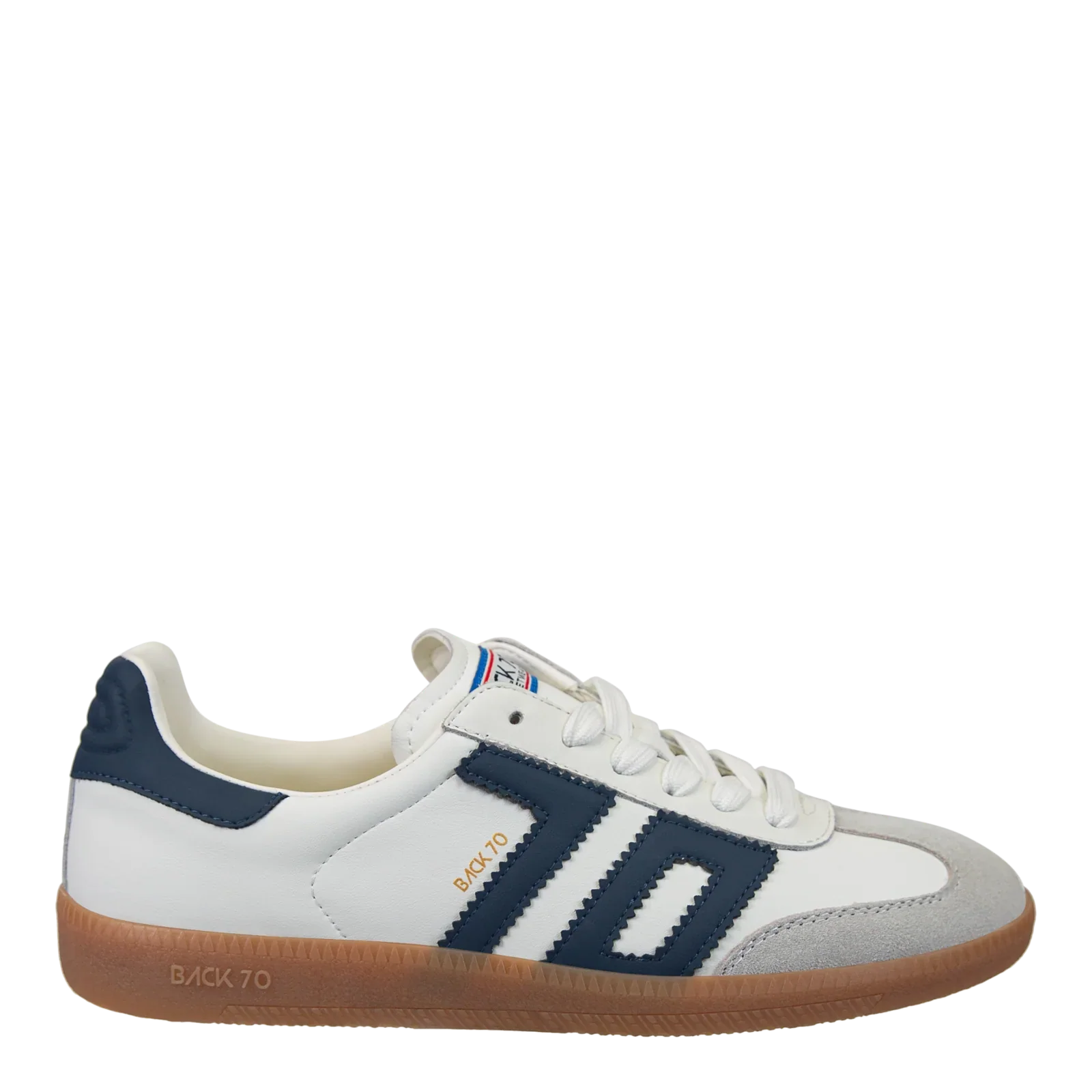 The Zertz CLOUD IN NAVY SNEAKER is a white, soccer-inspired shoe with navy stripes, gold BACK 70 text, a gray toe cap, white laces, and a light brown gum sole for standout street style.