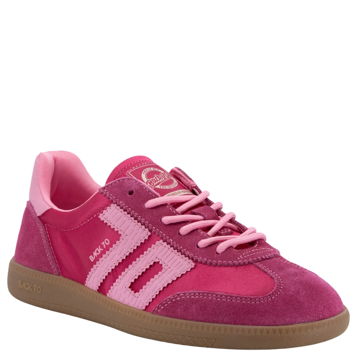 The Zertz GHOST C26 IN FUXIA SNEAKER features pink suede, light pink stripes, pink laces, a tan rubber sole, and BAK.70 text on the side—ideal for adding sporty style to any casual look.