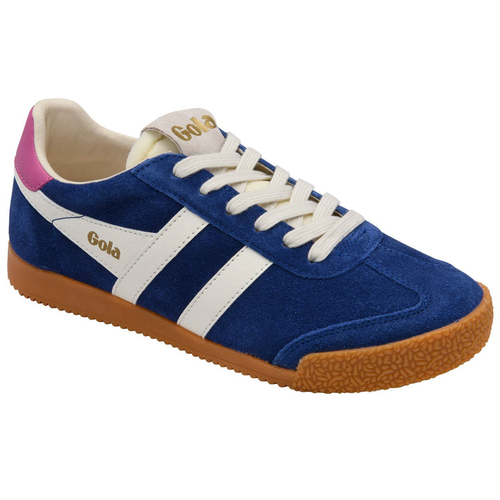 The ELAN TRAINER CLB538ET by Zertz is a blue suede sneaker with white laces, white side stripes, a brown rubber sole, and a pink heel accent. “Zertz” features in gold on the side and tongue.