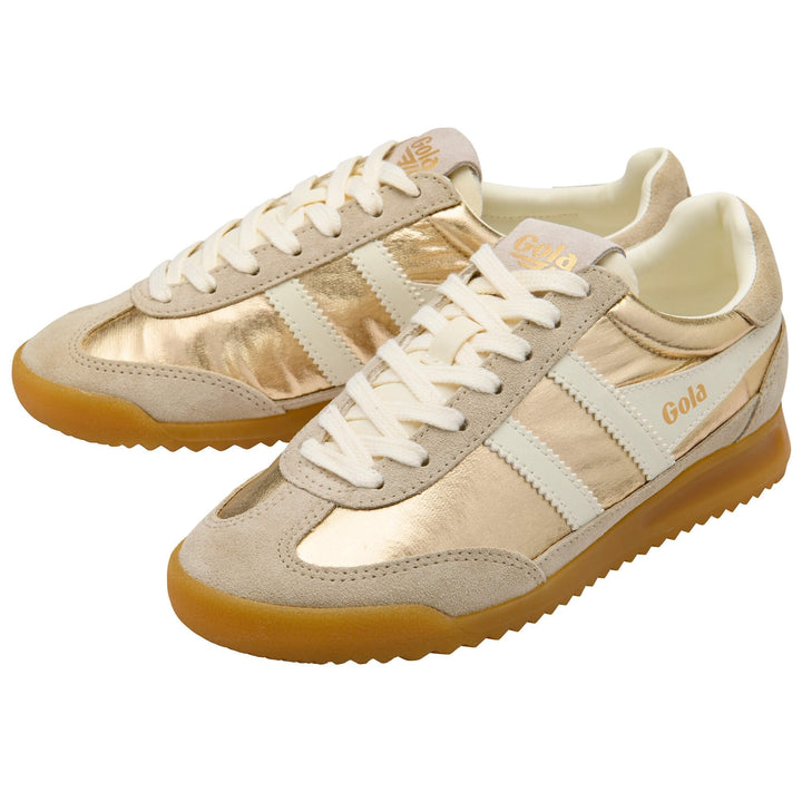 The Zertz FIREFLY NETALLIC TRAINER CLB858YW20 sneakers feature metallic gold panels, beige suede accents, white stripes, white laces, and gum rubber soles.