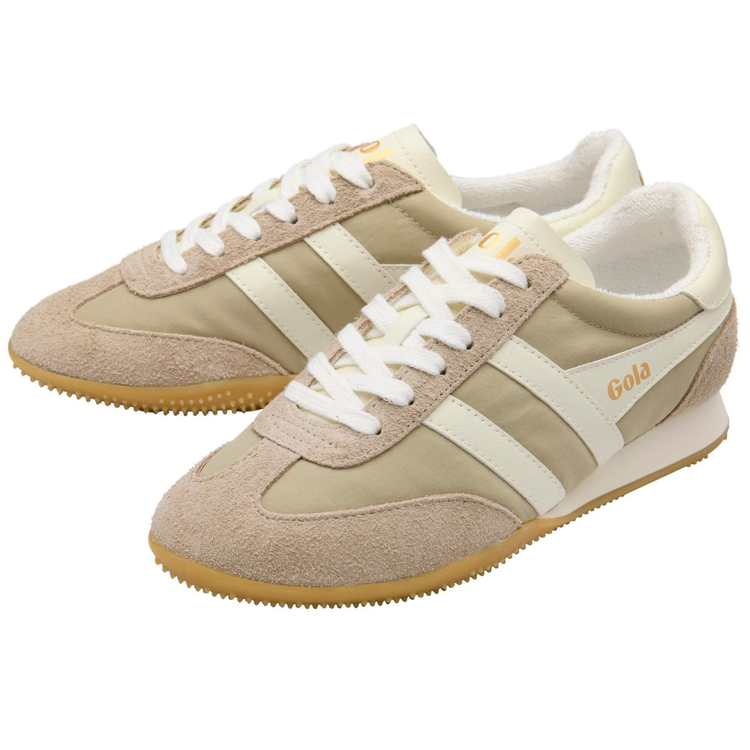 A pair of SPRINTER TAINER sneakers by Zertz in beige and off-white with bone suede and fabric panels, white laces, gum rubber soles, white stripes, and a gold Zertz logo on the side.