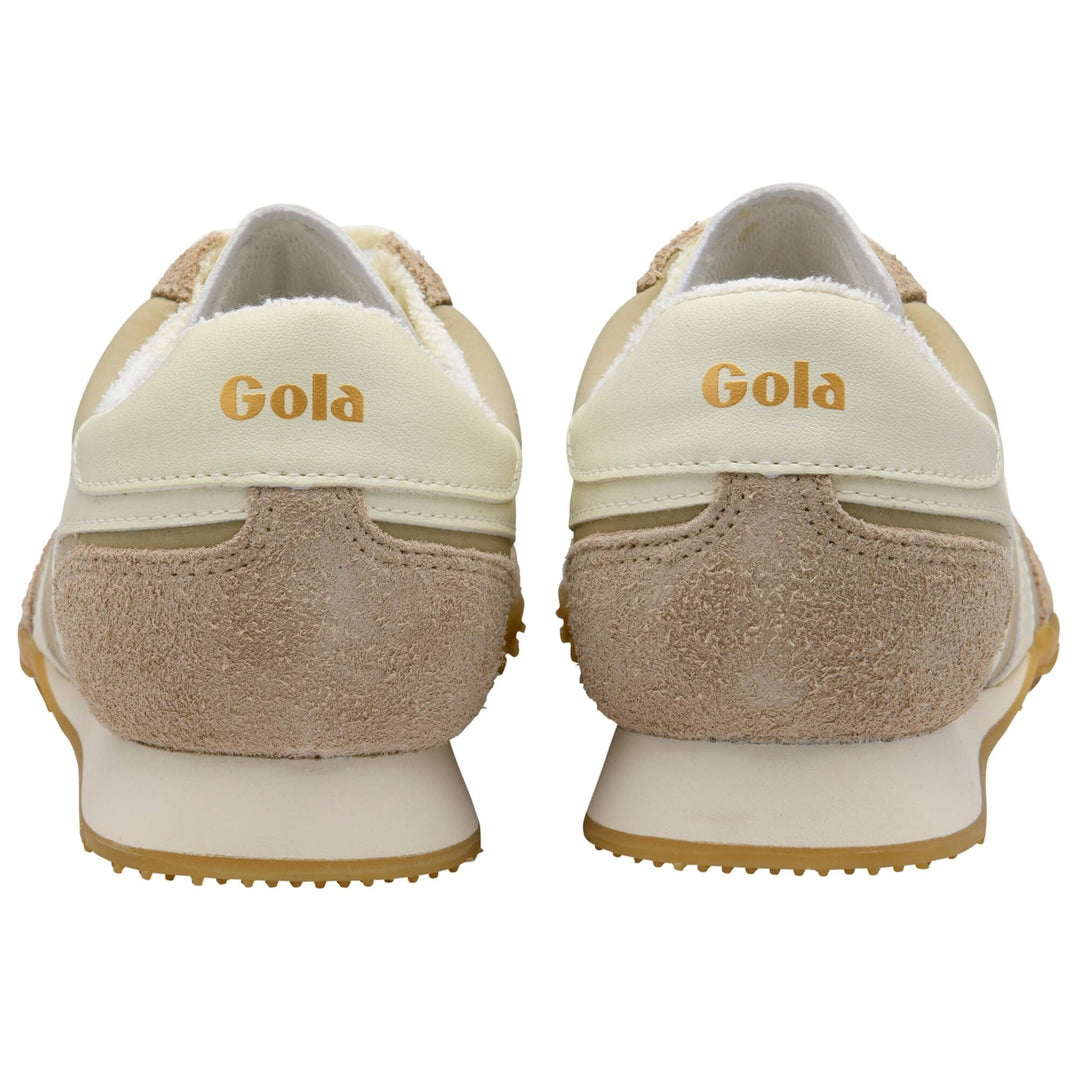 Rear view of a pair of bone suede SPRINTER TAINER sneakers by Zertz, featuring beige and cream suede and leather accents with the brand name Zertz in gold lettering on the heel.