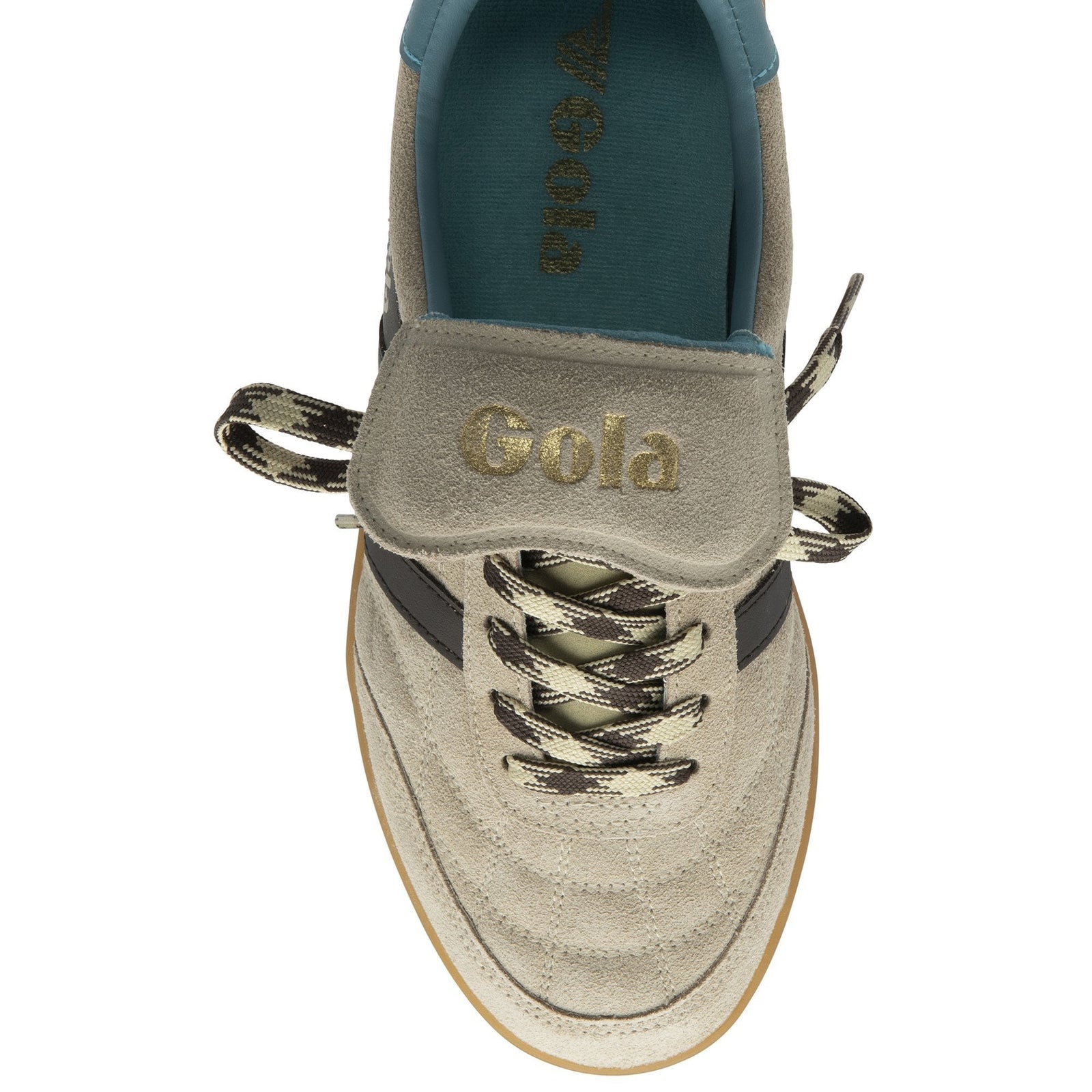 Top view of the Zertz STADIA 86 TRAINER in Bone/Mocha/Ocean/Gum, displaying a vintage football-inspired silhouette, beige upper with gold branding on the tongue, black and beige zigzag laces, teal insole, and gum-colored sole.