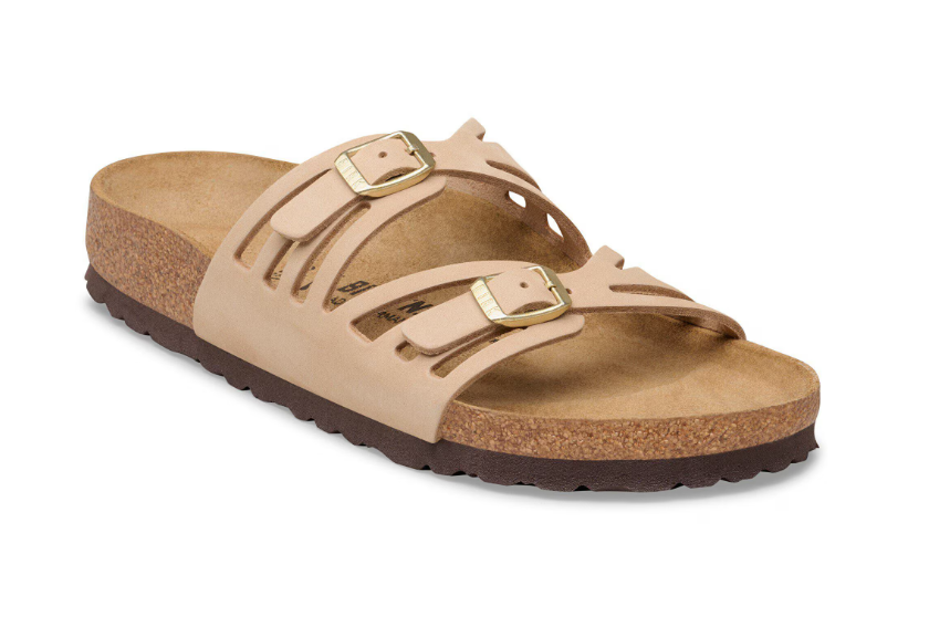 A tan Zertz GRANADA LENB SANDCASTLE R sandal with two adjustable nubuck leather straps, gold buckles, an open toe, cork footbed, and a textured dark brown sole for a natural look.