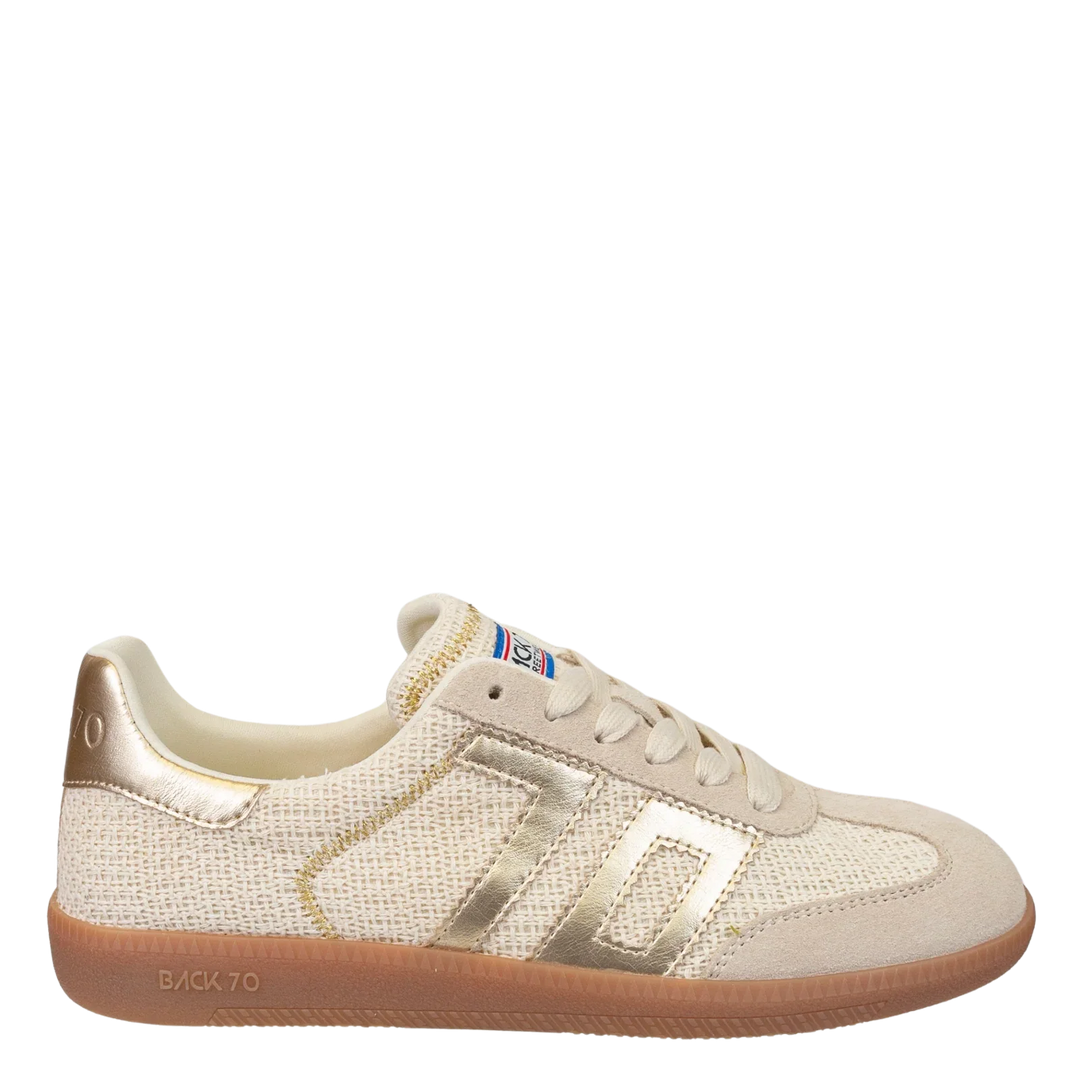 The Zertz IUTA 2512 GOLD SNEAKER features a beige design with metallic gold accents on the sides, heel, and laces, white laces, a gum sole, and a logo label on the tongue for a sporty yet stylish look.