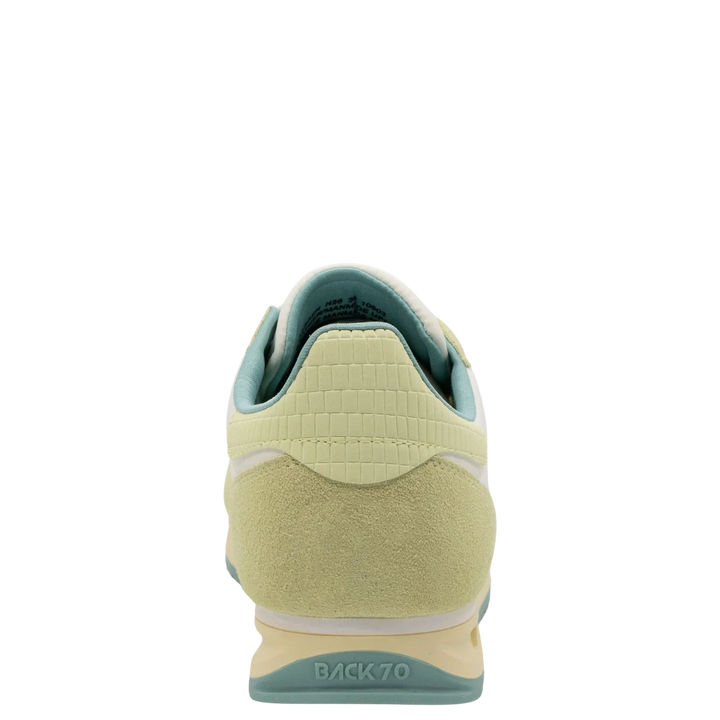 The JOGGER N26 sneakers by Zertz in pastel yellow and light green feature a suede heel, textured upper, and BACK 70 embossed above the heel—offering subtle sportswear luxury when viewed from the back.