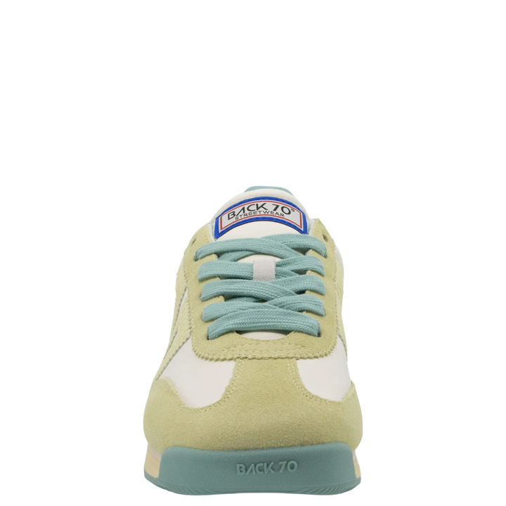 Front view of Zertz JOGGER N26 in SNEAKERS: pastel leather with light green suede, white panels, teal laces, blue and red BACK 70 tongue logo, plus pale teal toe cap and sole embossed with BACK 70 for a quiet luxury sportswear touch.