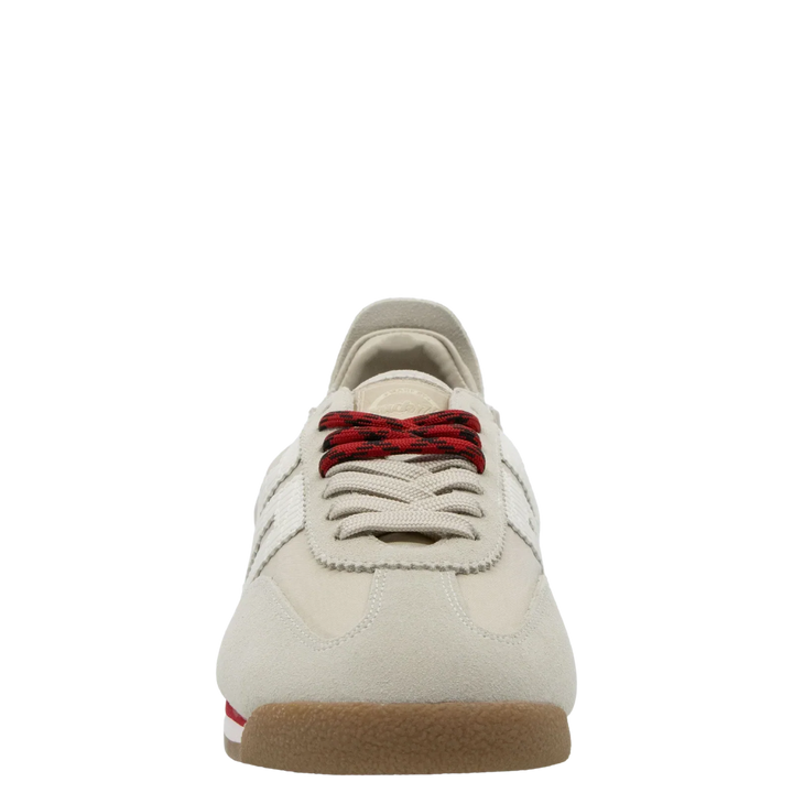 The Zertz ROCKET SAND SNEAKERS are light beige, running-inspired shoes with sporty red and black striped laces, white side stripes, and a gum sole featuring a small red accent for a casual style.