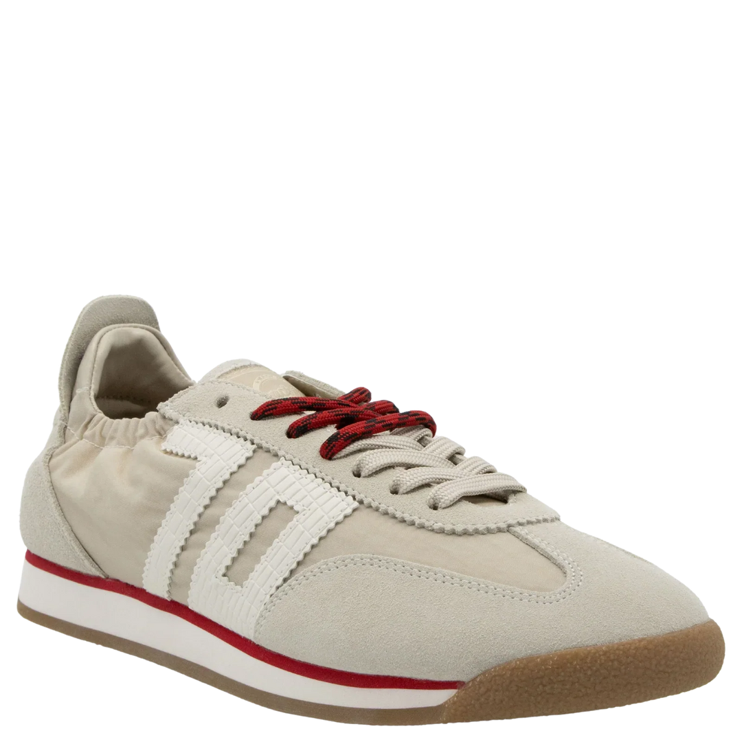 The Zertz ROCKET SAND SNEAKERS are beige, retro-inspired fashion sneakers with white stripes, red accents and laces, sporty details, a gum sole, white midsole, and a low-profile design with a padded heel collar for casual style.
