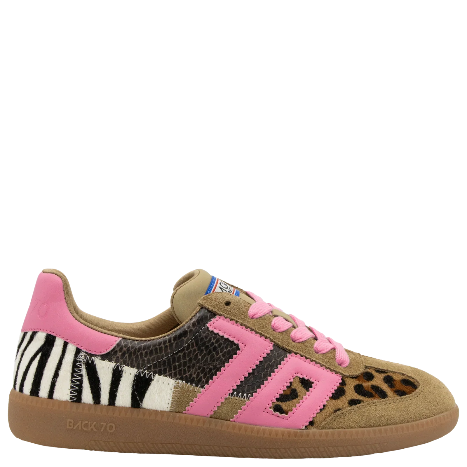 The Zertz SQUID IN LEOPARD ZEBRA FUXIA SNEAKER features zebra, leopard, and snakeskin patches, tan suede accents, pink laces, a pink 70 logo, and a light brown rubber sole for a unique vintage look.