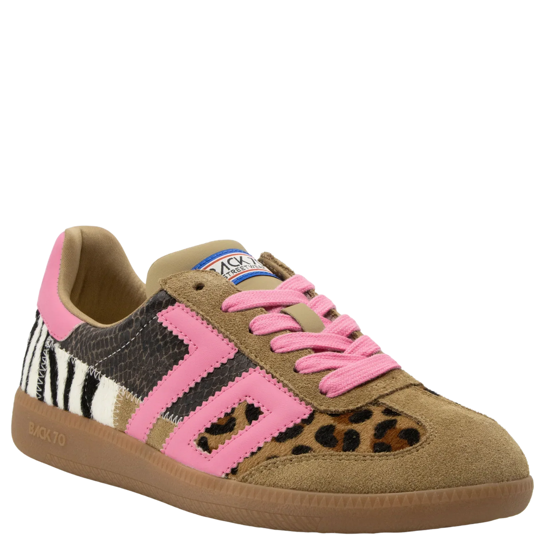The Zertz SQUID IN LEOPARD ZEBRA FUXIA SNEAKER features a vintage design with a brown suede toe, pink accents and laces, mixed zebra and leopard prints, and a tan sole for a bold animal print look.