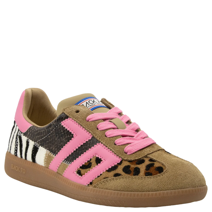 The Zertz SQUID IN LEOPARD ZEBRA FUXIA SNEAKER features a vintage design with a brown suede toe, pink accents and laces, mixed zebra and leopard prints, and a tan sole for a bold animal print look.
